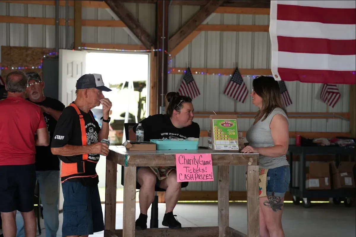 Post 4093 volunteers staffing the charity game ticket table at an event